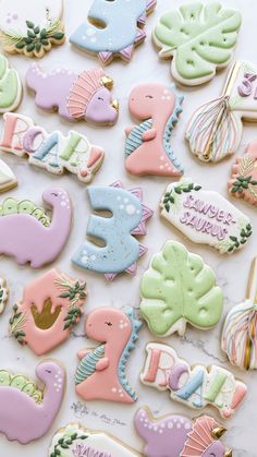 some decorated cookies are laying on a table