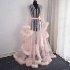 This Is An Elegant, Sexy And Luxurious Sheer Robe With A Feather/Fur Trim And A Gorgeous Satin Tie. This Sheer Gorgeous Gown/Robe Is Perfect For Boudoir And Romantic Moments. You Can Use This Sheer Feather Peignoir With Beautiful Marabou Boas For You Wedding Day, Dancing, Photoshoot Or Romantic Evenings. High Quality Tulle And Marabou Feathers With A Satin Ribbon At The Waist. Perfect For Use As Lingerie Or As A Bridal Robe. Color: Light Pink Size: S/M Runs Large ... This Was Custom Fit For A 5' Feather Bridal Robe, Polka Dot Wedding Dress, Unique Boho Wedding Dress, Fancy Robes, Pijama Satin, Bridal Fur, Wedding Scarf, Sheer Robe, Wedding Jumpsuit