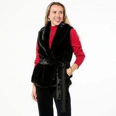 TWRHLL by Christie Brinkley Belted Faux Fur Vest This sleeveless faux fur vest with a belted waist gives you just the right amount of winter warmth. Layer it over any of your cold weather wardrobe staples for stylish outfits that become your signature "wow" looks.