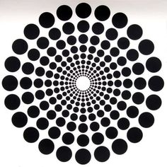 an abstract black and white image with circles in the center, forming a spiral pattern