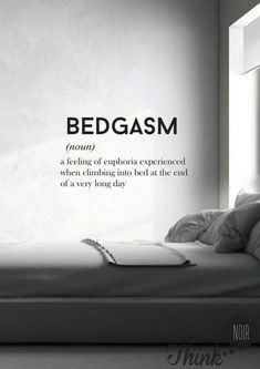 a bed in front of a window with the words bedgasm written on it