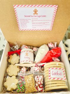 an open box filled with cookies and other holiday treats for someone's special occasion