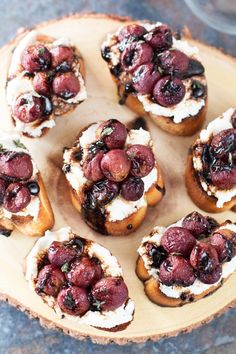 small cranberry and goat cheese appetizers on a wooden platter, ready to be eaten