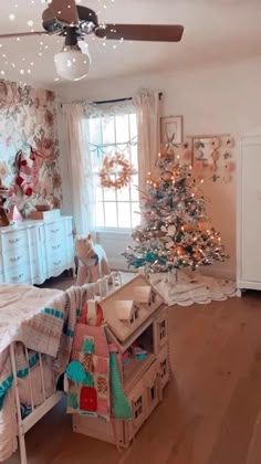 a bedroom with a christmas tree in the corner and other decorations on the wall behind it