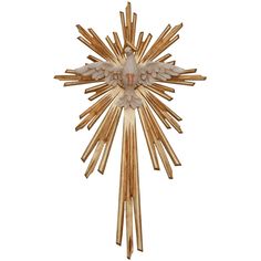 a gold and white star shaped object with flowers on it's back end, in the shape of a sunburst