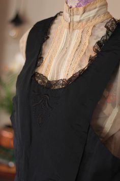 Stunning 1900s French folk antique dress. An unique Edwardian dress, beautifully hand made from black silk and the neckline has been decorated back and front with a black lace. You can appreciate the beauty and elegance of this pinafore dress, both panels were hand embroidered in such delicate manner.  Size: 12 Lengths 49.5 inches  Chest 36 inches Folk Dress, Dirndl Dress, Edwardian Dress, Unique Hats, Cocktail Hat, Folk Dresses, Antique Dress, Pinafore Dress, Antique Lace