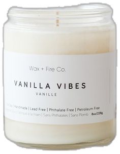 vanilla vibes candle with white label on the front and bottom, in a glass jar