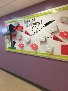 a bulletin board on the side of a building that says special delivery with red and white paper cut out of it