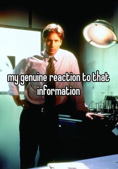 a man standing in front of a computer screen with the words my genuine reaction to that information