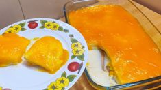 a plate with some food on it next to a casserole in a dish