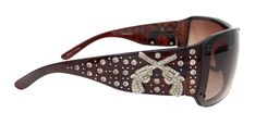 Montana West brand ladies western style sunglasses with crossed pistol concho decorated with rhinestones. Features: Rectangular shaped frame 100% UV 400 protection Comes with cleaning cloth and hard case with magnet closure 2000s Accessories, 2000s Sunglasses, 2000s Clothing, Cowgirl Bling, Rhinestone Sunglasses, Style Sunglasses, Purse Accessories, 2000s Fashion, Western Style