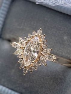 Engagement Rings Sunburst, Vintage Style Marquise Engagement Rings, Engagement Rings Marquise Halo, Over The Top Engagement Rings, Big Gold Diamond Ring, Moissanite Engagement Ring Yellow Gold, Engagement Ring Gold Marquise, Marquis Ring With Halo, Vintage Look Engagement Rings