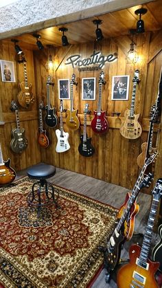 a room filled with guitars and musical equipment