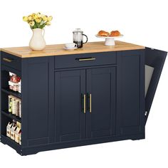 a kitchen island with two trays on it and flowers in a vase next to it