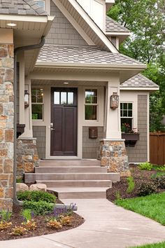 a house with stone steps leading up to the front door