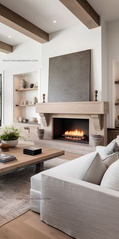 a living room filled with furniture and a fire place in the middle of the room