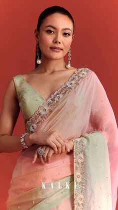 A nod to timeless traditions with a modern spin is this shaded sea green and light pink crepe silk saree. A statement silhouette for special celebrations, it is adorned with delicate embellishments in accents of cutdana, beads and sequin. Paired with an unstitched blouse piece to help you showcase you exquisite style, this drape adds to festive charm.