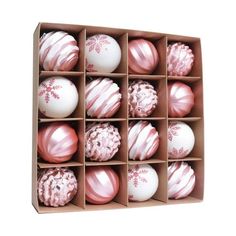 twelve pink and white ornaments in a cardboard box