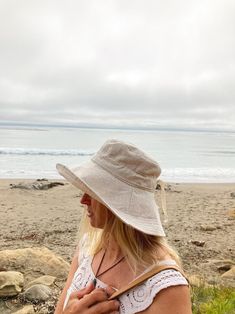 A sun hat for beach days and summer fun. Comfortable fit and breathable linen. This sun hat for women has a nice wide brim.. Easy to bring along in your bag, folds up easy. Shop at Bluecorduroy.etsy.com  #linenhat #womenshat #sunhat #beachhat #beachstyle #accessory #summerhat Lightweight Coastal Sun Hat For Summer, Coastal Style Lightweight Sun Hat For Summer, Adjustable Brimmed Bucket Hat For Beach Season, Beachy Cream Sun Hat For Vacation, Coastal Style Lightweight Summer Sun Hat, Beachy Sun Hat With Uv Protection, Lightweight Coastal Sun Hat For Vacation, Coastal Lightweight Sun Hat For Vacation, Adjustable Cotton Beach Hat