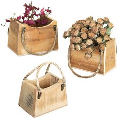 two wooden boxes with flowers in them on a white background, one is holding a purse and the other has a handle