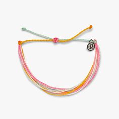 Pura Vida multi strand corded bracelet in varying shades of pink, white, and orange with a Pura Vida logo charm Charms For Bracelets Pura Vida, Cute Charm Bracelets Pura Vida, Puravida Bracelets Bead, Puravida Bracelets Diamond, Turquoise Jewelry Pura Vida, Puravida Bracelets Packs, Pura Vida Bracelets Dreaming Outloud Set, Puravida Bracelet Sets, Cute Necklace Pura Vida