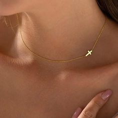 14K GOLD Sideways Cross Necklace Introducing the Tiny Gold Cross Choker, the most charming cross choker you'll find. Ideal as a special treat for yourself or a thoughtful gift for others, this delicate piece is sure to add a touch of beauty to any occasion. Crafted with love, this personalized handmade jewelry is a genuine showcase of quality and beauty--an ideal gift for your loved one with a 2 year warranty. Product Details *  Cross is off-centered to the left side unless requested to be cente Cross Necklace Gold, Necklace Gold Pendant, Sideways Cross Necklace, Cross Necklace Sideways, Cross Choker, Gold Cross Necklace, Gold Cross, Minimalist Necklace, Gold Pendant Necklace