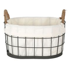 a white and black wire basket with two handles on the bottom, filled with fabric