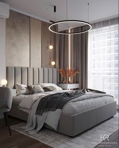 a bedroom with a large bed in the middle and a round light fixture above it