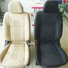 two black and tan leather seats sitting next to each other in a room with tile flooring