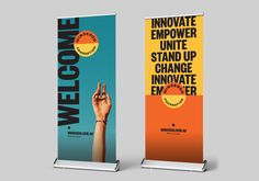 two roll up banners with the words welcome to me and an image of someone's hand