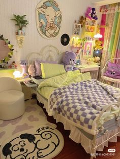 a bedroom decorated in pastel colors with teddy bears on the bed and rugs