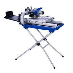 a table saw is sitting on top of a blue stand with two tools attached to it