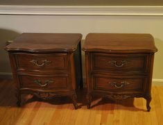 two wooden nightstands sitting next to each other on top of a hard wood floor