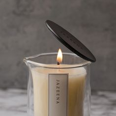 This Jazeena Candle Cover will elevate the aesthetic of your home while helping your Body Serum Candles avoid: ✨ Aging Poorly✨ Looking Messy✨ Losing Scent Strength Crafted from durable, sustainable zinc metal for lasting quality with an elegant matte black finish and a beautiful Jazeena engraving. This cover is re-usable for every Body Serum Candle purchase and is the perfect way to preserve your serum. When the candle is in use, the lid can be used as a base. Measures 2.8” x 0.25” (D x H) Serenity Essential Oil, Refill Packaging, Massage Candles, Fragrance Oil Blends, Babassu Oil, Massage Candle, Candle Cover, Camellia Oil, Rose Perfume