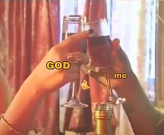 two people toasting wine glasses with the words god me