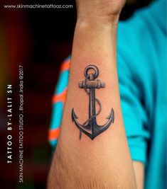 an anchor tattoo on the wrist