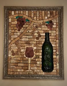 a wine bottle sitting on top of a cork covered wall