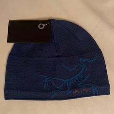 Arcteryx Teal Bird Head Magician Beanie Hat 211209bk Arcteryx Hat, Custom Fitted Hats, Teal Bird, Bird Head, Knit Beanies, Black Snapback, Grey Beanie, Grey Pullover, Grey Shoes