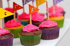 cupcakes with colorful frosting and small flags