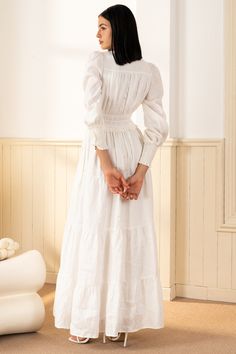 FINAL SALE! NO RETURNS. NO EXCHANGES. Georgia Maxi Dress will make a lasting impression at your next spring event! With an elastic waist, long sleeves, and tiered peasant skirt. LENGTH: 52" from top of shoulder FABRICATION: 100% White Linen STYLE#;DR-21450 White Linen - WHITE-S24 *Dry Clean or wash on cold and hang flat to dry *Model is wearing size XS White Peasant Dress, Temple Dresses, Georgia Dress, Cute Mothers Day Gifts, Temple Dress, Peasant Skirt, Spring Event, Dream Wedding Ideas Dresses, Linen White