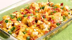 a glass casserole dish filled with potatoes and bacon