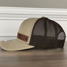 Freedom American Flag Patriotic Leather Patch Hat Khaki/Brown. Specifications: 🧢 Richardson original 112 trucker; adjustable for the perfect fit 🎩 60/40 cotton/polyester blend for comfort 📏 One size fits most 🏷️ Expertly laser engraved leatherette patch design 📦 Ships in 2 to 3 business days from our Orlando Studio Care Instructions: 🚫 Do not wash; spot clean only Please Note: 🌈 Colors may vary from photos based on your viewing screen. Brown Adjustable Cap, Adjustable Brown Cap, Adjustable Brown Leather Baseball Cap, Brown Baseball Cap With Flat Bill, Brown Flat Bill Baseball Cap For Outdoor, Brown Adjustable Flat Bill Baseball Cap, Adjustable Urban Brown Hat, Casual Brown Adjustable Snapback Hat, Casual Brown Leather Hat