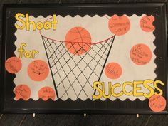 a bulletin board with writing on it that says shoot for success and an image of a basketball net