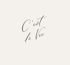 the words'est la vie'written in cursive handwriting