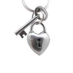 a heart shaped key is attached to a metal chain