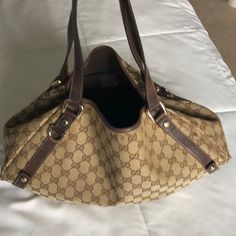 Beautiful Comfortable Authentic Used Gucci Hobo Bag. Used With Love. Gold Tone Hardware. See Pics For Wear Marks. Purchased At Neiman Marcus Boston. Classic Pre-owned Shoulder Bag With Double Handle, Luxury Pre-owned Brown Bag, Brown Gucci Satchel With Gold-tone Hardware, Gucci Brown Satchel With Gold-tone Hardware, Classic Brown Gucci Satchel, Brown Gucci Bag For Everyday Use, Gucci Brown Shoulder Bag Satchel, Gucci Brown Satchel For Shopping, Classic Brown Gucci Shoulder Bag