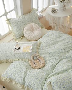 a bed with pillows and some shoes on it