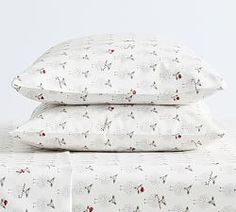 two pillows are stacked on top of each other