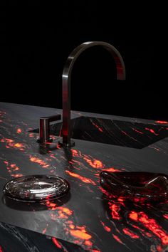 a sink that has some red lights on it