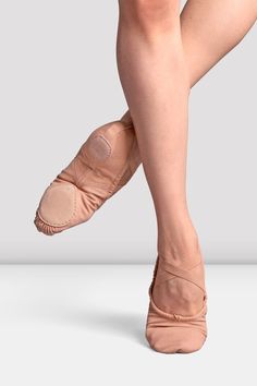 the legs and feet of a woman in ballet shoes